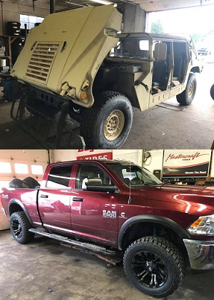 military-style vehicle and Ram 2500 in service garage at Tom's Tires